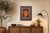 Culture Stick Man #10 2026 by Marvin Gustilo above a console in a cozy traditional home